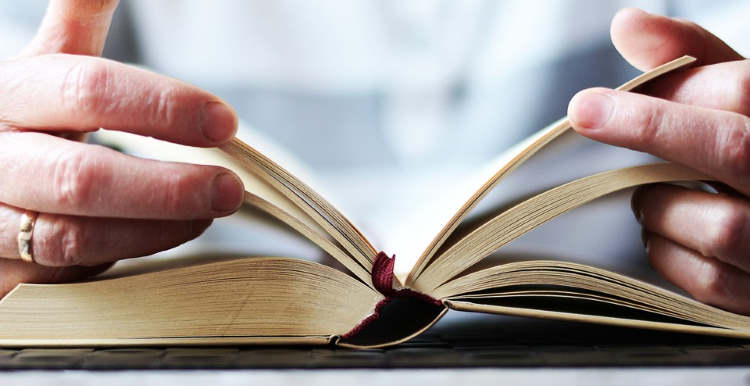 god-habit Male hands holding open different parts of a bible