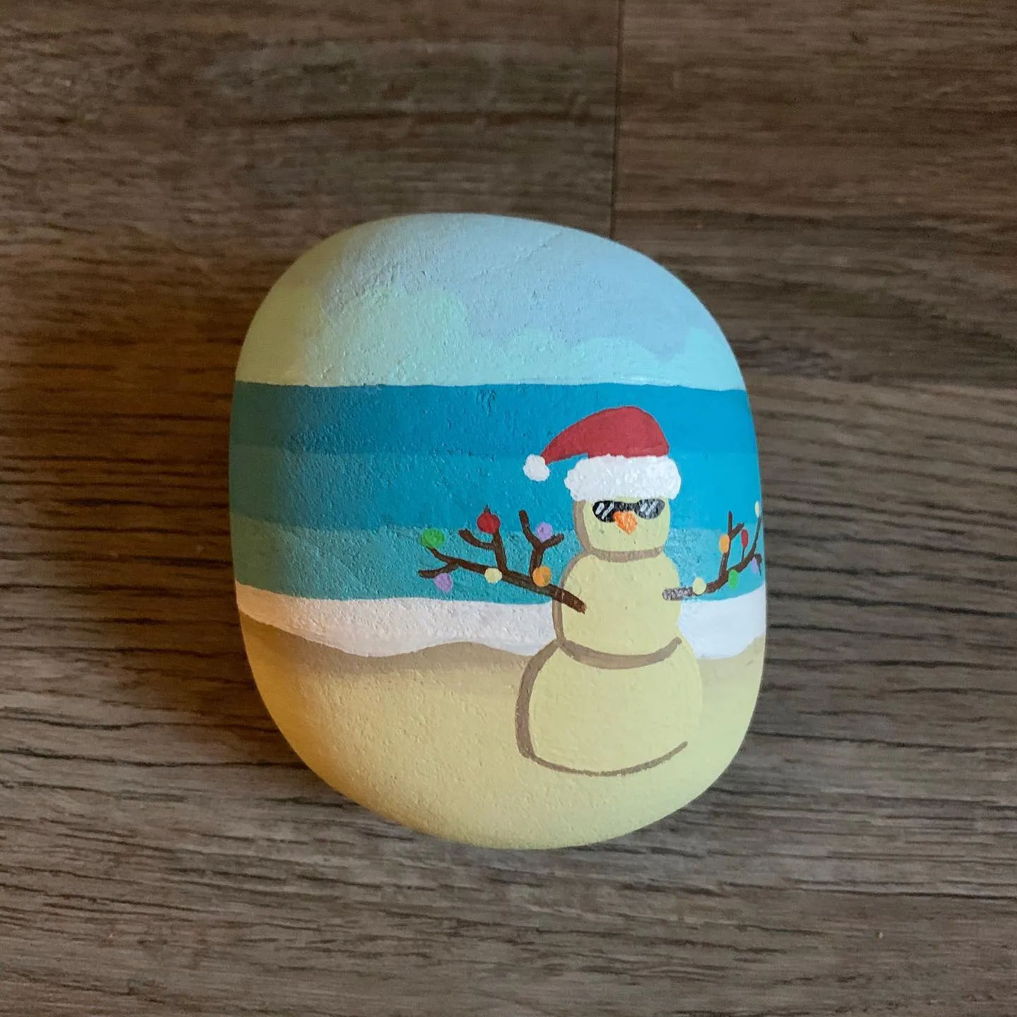 75+ of the Best Christmas Painted Rocks of Instagram 17 beach sandman painted rock