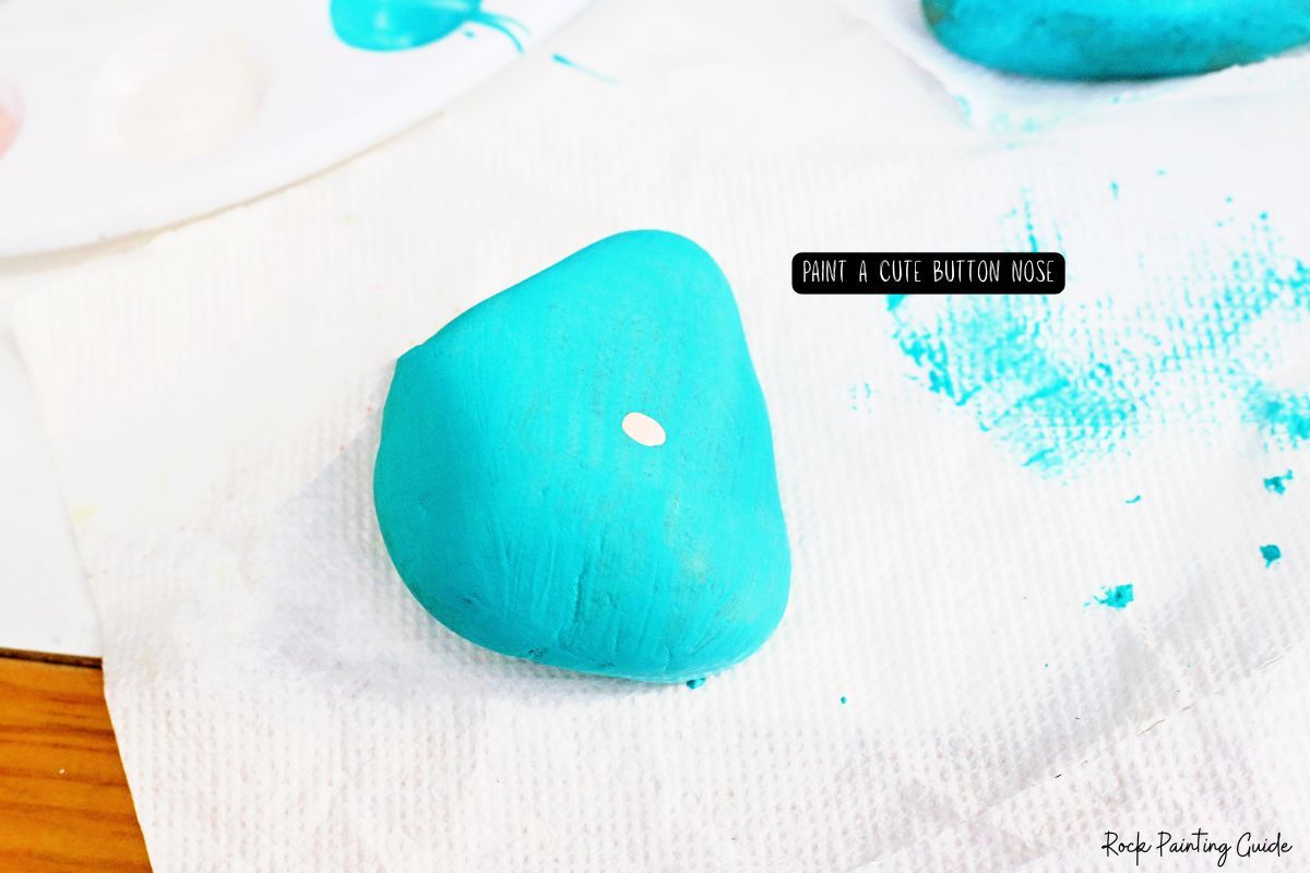 How To Make Adorable Christmas Gnome Painted Rocks 6 paint a button nose for the gnome painted rocks