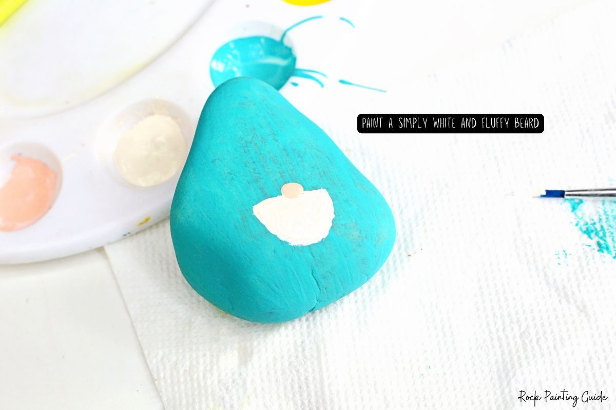 How To Make Adorable Christmas Gnome Painted Rocks 7 Paint a white fluffy beard for the gnome painted rock