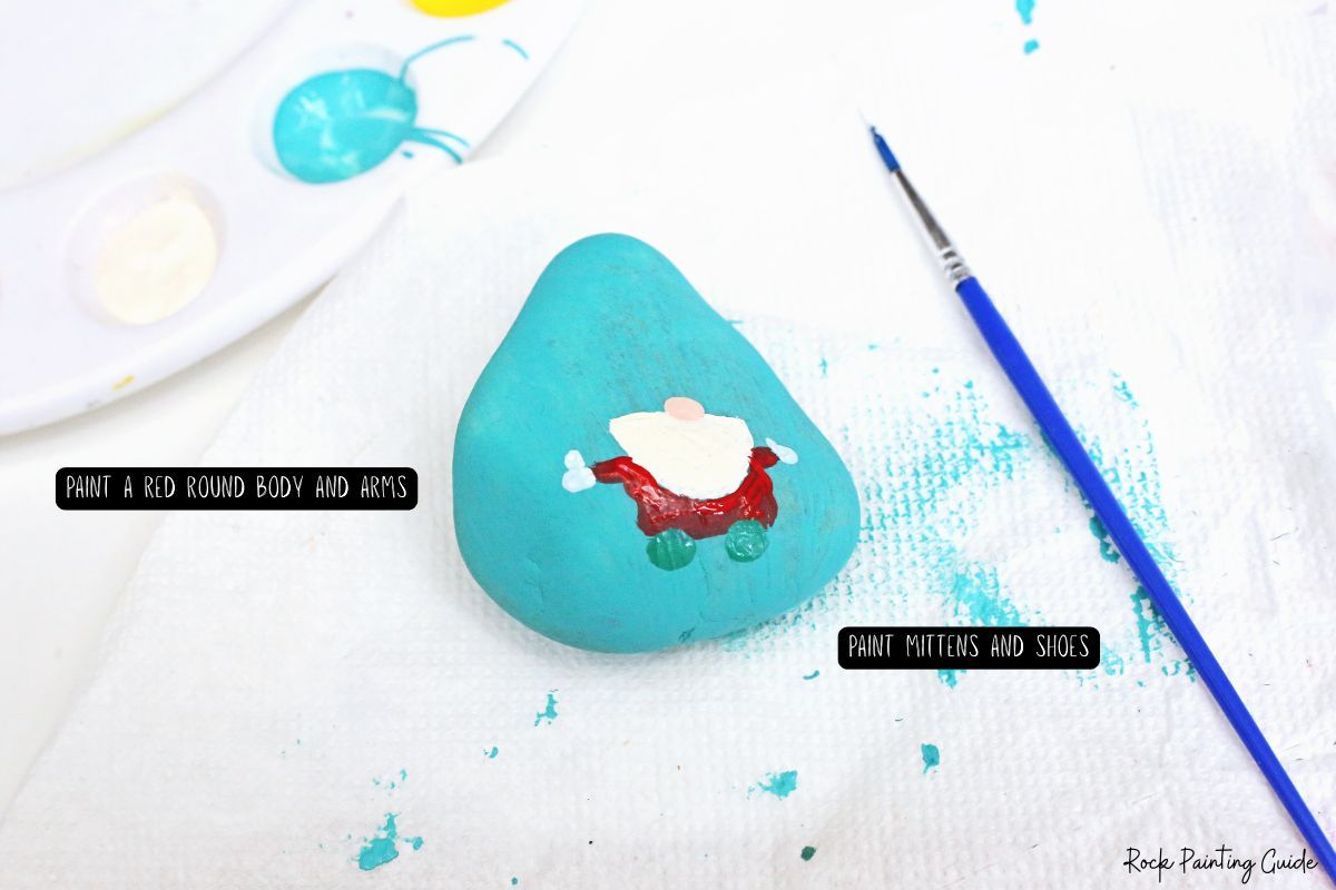 How To Make Adorable Christmas Gnome Painted Rocks 8 Paint the body of the Christmas gnome painted rocks