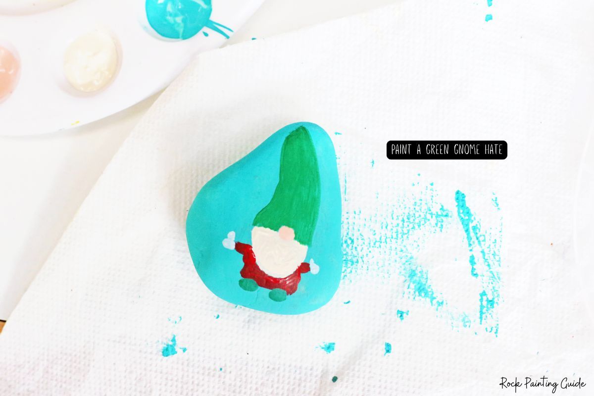 How To Make Adorable Christmas Gnome Painted Rocks 9 paint a green gnome hat on the gnome painted rock