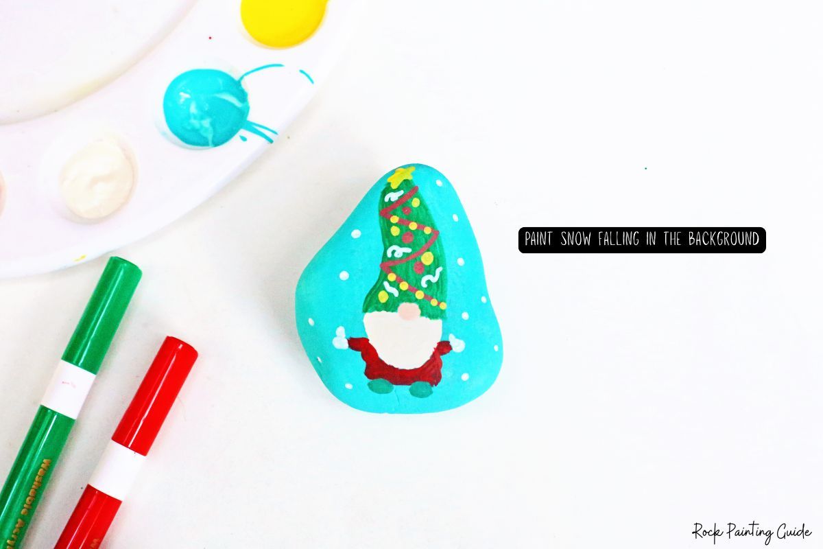 How To Make Adorable Christmas Gnome Painted Rocks 11 paint snowflakes around the gnome