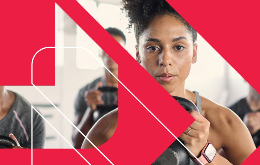 Person training a client in a gym