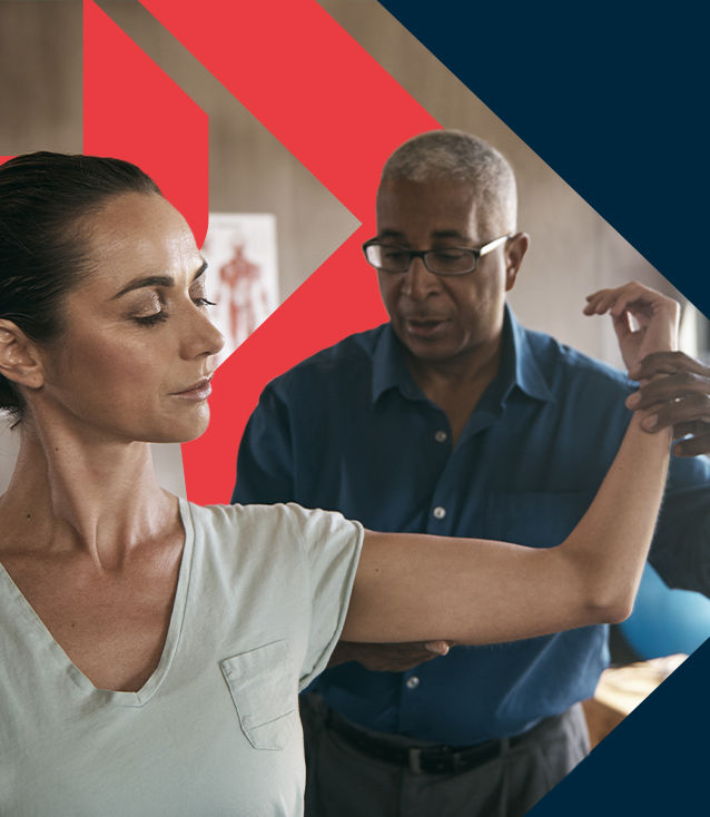 A BioMechanics Method Corrective Exercise Specialist testing a client's range of motion during a shoulder evaluation in a clinical setting