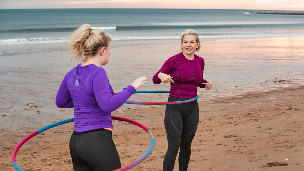 Do Weighted Hula Hoops Work? Trainers Explain All Of The Potential Benefits (Women's Health)