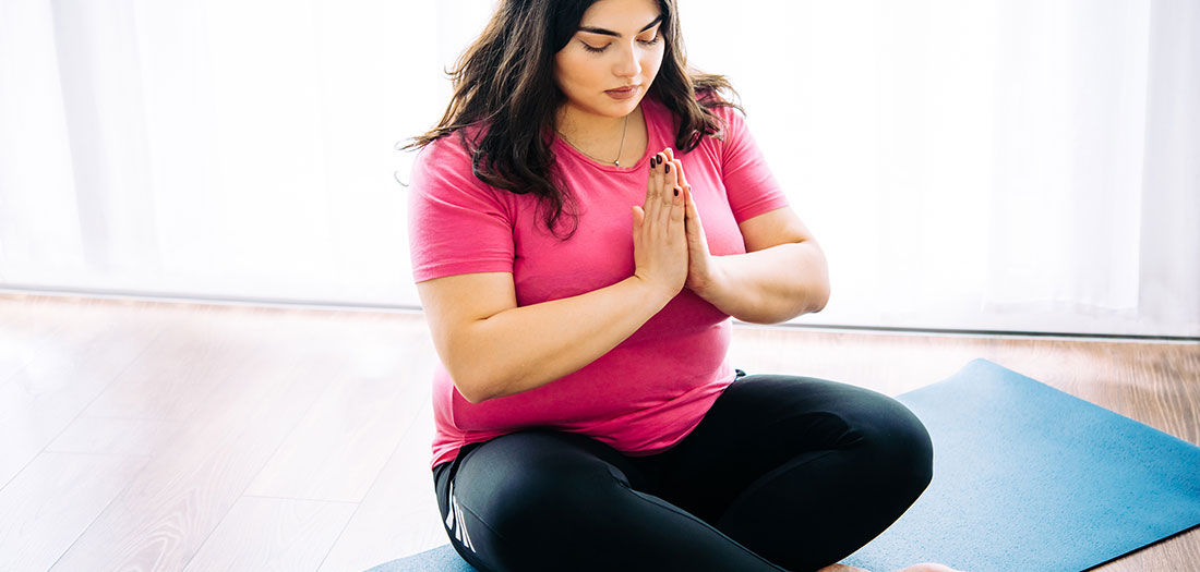 Forward fold modifications for larger bodies (Uttanasana) - Body Positive  Yoga