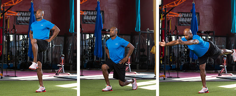 Pilates class of athletes doing a standing lunge exercise on