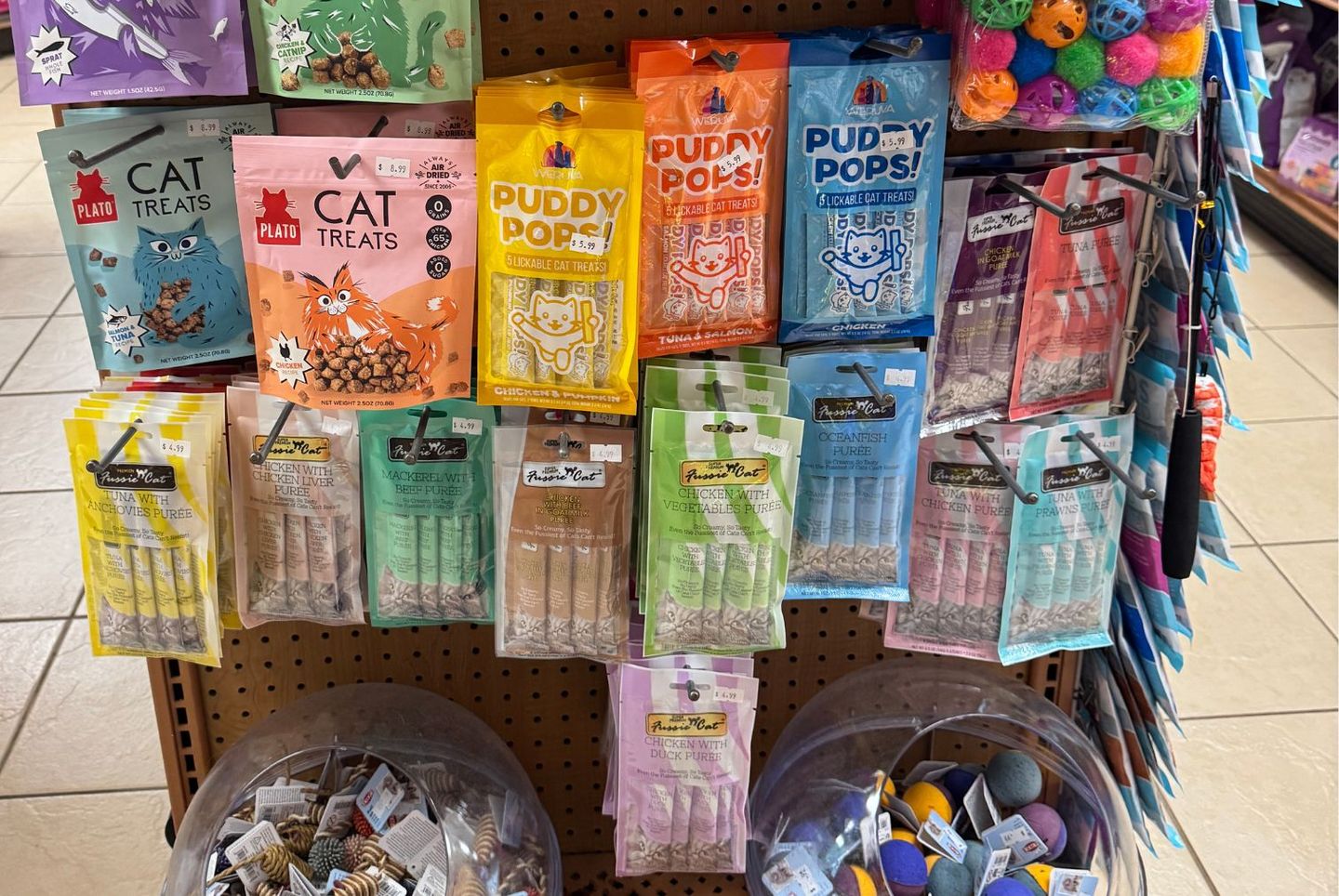 An assortment of toys and enrichment for cats offered at JM Pet Resort's Retail Store.