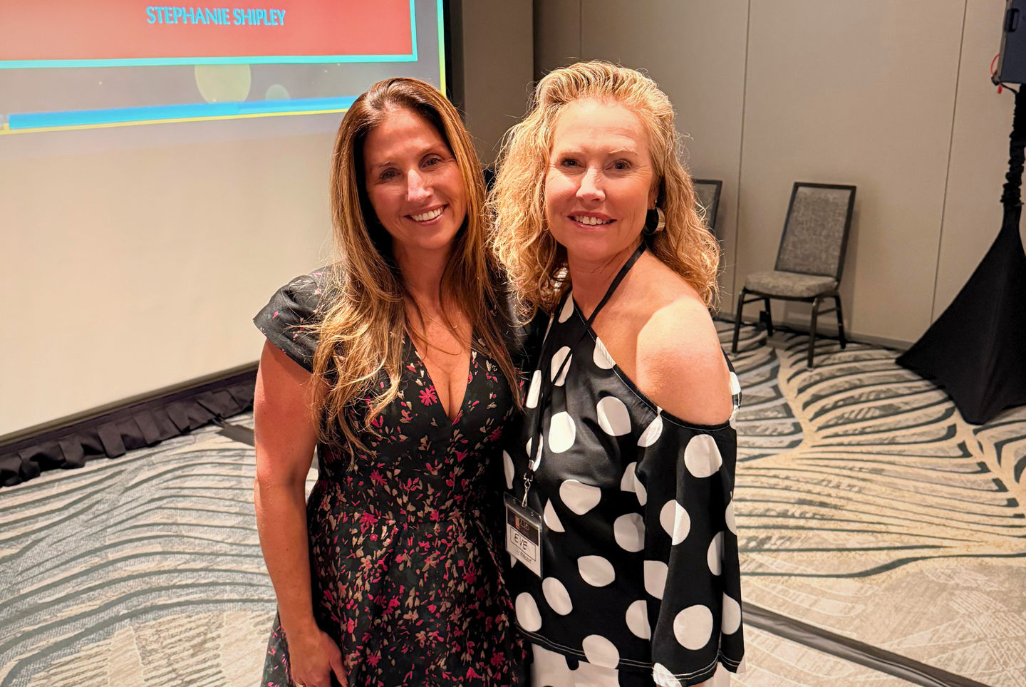 Jeni Mather (left) stands beside [Name] (right) at the 2026 CANIS Conference. 