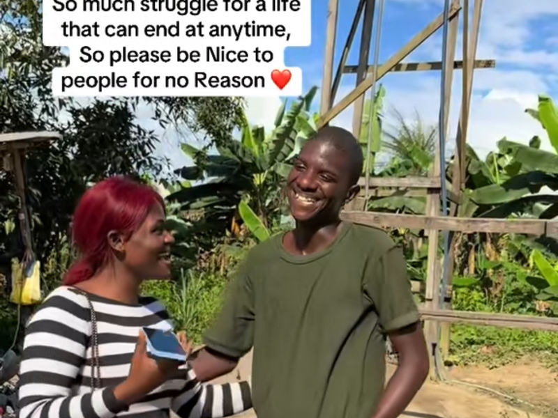 A woman and a smiling young man talk outdoors; a social-media caption is printed across the image