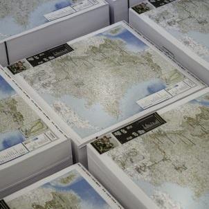 Printed maps in a pile