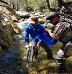 Students at Warrenton High School working with hatchery equipment