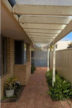 Timber pergola over the side path of a Perth home, before removal