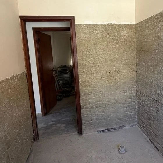 Bathroom strip out in Perth: tiles off and walls taken back to render