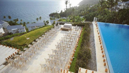Aerial view of Xeliter Vista Mare hotel in Samana, showing hillside residential buildings overlooking the sea and private beaches