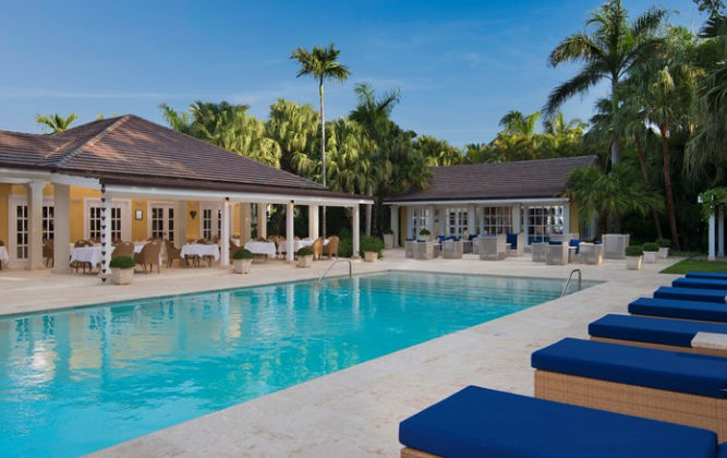 Outdoor swimming pool surrounded by tropical gardens at Hotel La Tortuga Las Terrenas
