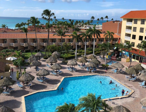 Facade and pool areas of Casas Del Mar Hotel Beach & Spa resort in Punta Cana