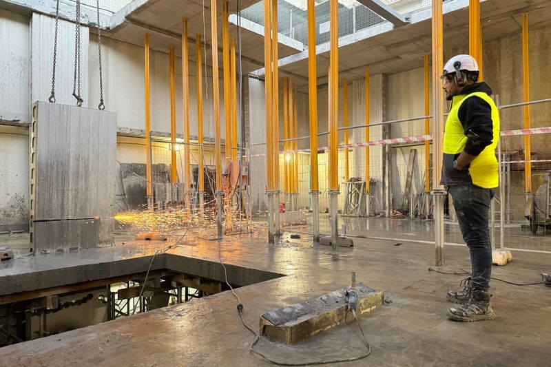 Concrete cutting through suspended basement slab