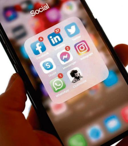 (FILES) In this file illustration photo taken on January 25, 2021 shows the application Clubhouse on a smartphone in Berlin. - Clubhouse, the invitation-only audio chat app, exploded in popularity during the coronavirus pandemic, with people unable to get together for in-person conversations. Now, the trendy platform launched less than a year ago -- which made headlines by quickly earning China's scorn -- is looking to establish itself as the standardbearer for digital audio. (Photo by Odd ANDERSEN / AFP)