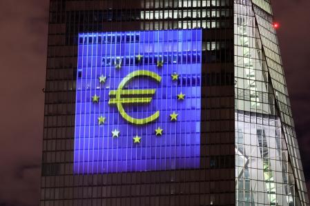 A symphony of light consisting of bars, lines and circles in blue and yellow, the colours of the European Union, illuminates the south facade of the European Central Bank (ECB) headquarters in Frankfurt, Germany, December 30, 2021.   REUTERS/Wolfgang Rattay