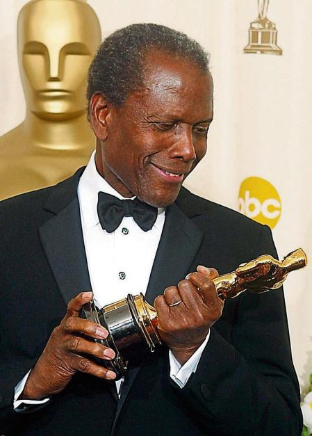 (FILES) In this file photo taken on March 23, 2002, US actor Sidney Poitier admires his honorary Oscar at the 74th Academy Awards in Hollywood. - Sidney Poitier, Hollywood's first major Black movie star, has died, the deputy prime minister of the Bahamas said on January 7, 2022. Poitier, who held dual US and Bahamian nationality, was 