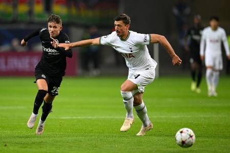FRANKFURT AM MAIN, GERMANY - OCTOBER 04: Jesper Lindstrom of Eintracht Frankfurt battles for possession with Clement Lenglet of Tottenham Hotspur during the UEFA Champions League group D match between Eintracht Frankfurt and Tottenham Hotspur at Deutsche Bank Park on October 04, 2022 in Frankfurt am Main, Germany. (Photo by Matthias Hangst/Getty Images)