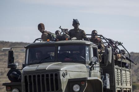 FILE - Ethiopian government soldiers ride in the back of a truck on a road near Agula, north of Mekele, in the Tigray region of northern Ethiopia on May 8, 2021. Ethiopia's warring sides have formally agreed to a permanent cessation of hostilities in a 2-year conflict, negotiators for the parties announced Wednesday, Nov. 2, 2022. (AP Photo/Ben Curtis, File)