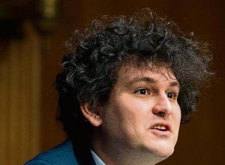 (FILES) In this file photo taken on February 09, 2022, Samuel Bankman-Fried, founder and CEO of FTX, testifies during a Senate Committee on Agriculture, Nutrition and Forestry hearing about 