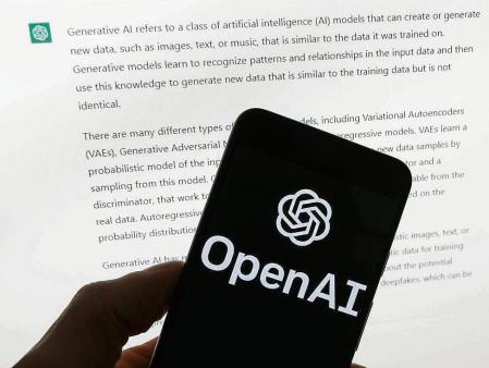 FILE - The OpenAI logo is seen on a mobile phone in front of a computer screen displaying output from ChatGPT, March 21, 2023, in Boston. The head of the artificial intelligence company that makes ChatGPT is set to testify to Congress as lawmakers call for new rules to guide the rapid development of AI technology. OpenAI CEO Sam Altman is scheduled to speak at a Senate hearing Tuesday, May 16. (AP Photo/Michael Dwyer, File)