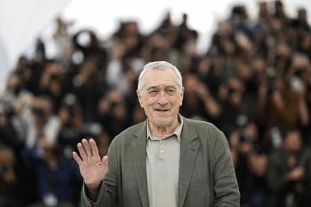 US actor Robert De Niro waves during a photocall for the film 