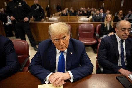 Former U.S. president and Republican presidential candidate Donald Trump awaits the start of proceedings for allegedly covering up hush money payments linked to extramarital affairs at Manhattan criminal court in New York, U.S., April 22, 2024. Yuki Iwamura/Pool via REUTERS