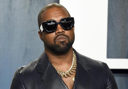 FILE - Kanye West arrives at the Vanity Fair Oscar Party in Beverly Hills, Calif., on Feb. 9, 2020. Kanye just wants to be Ye. Kanye West filed court documents Tuesday, Aug. 24, 2021, to legally change his name. (Photo by Evan Agostini/Invision/AP, File)