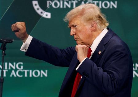 Republican presidential nominee and former U.S. President Donald Trump gestures on the stage at Turning Point Action's The Believers Summit 2024 in West Palm Beach, Florida, U.S., July 26, 2024. REUTERS/Marco Bello TPX IMAGES OF THE DAY