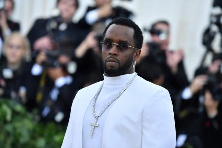 (FILES) Sean Combs arrives for the 2018 Met Gala on May 7, 2018, at the Metropolitan Museum of Art in New York. Music mogul Sean Combs is set to go on trial for racketeering and sex trafficking on May 5, 2025, a judge said in a court hearing October 10, 2024. The rapper known as 