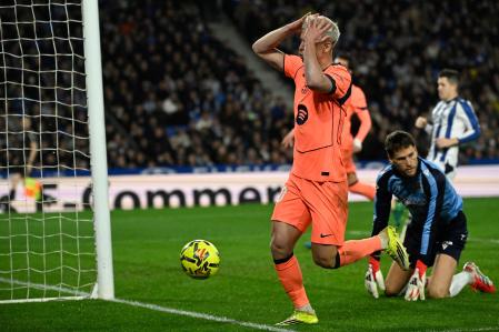 Barcelona's Spanish midfielder #20 Daniel Olmo reacts during the Spanish league football match between Real Sociedad and FC Barcelona at Anoeta Stadium in San Sebastian on January 18, 2026. (Photo by ANDER GILLENEA / AFP)