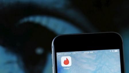 FILE PHOTO: The dating app Tinder is shown on an Apple iPhone in this photo illustration taken February 10, 2016. REUTERS/Mike Blake/Illustration/File Photo