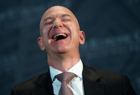 Jeff Bezos, founder and CEO of Amazon, laughs as he speaks during the Economic Club of Washington's Milestone Celebration event in Washington, DC, on September 13, 2018. (Photo by SAUL LOEB / AFP)        (Photo credit should read SAUL LOEB/AFP via Getty Images)