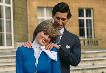 Charles, Prince of Wales laughing with his fiancee, Lady Diana Spencer (1961 - 1997), outside Buckingham Palace, after announcing their engagement, London, 24th February 1981. (Photo by Hulton Archive/Getty Images)
