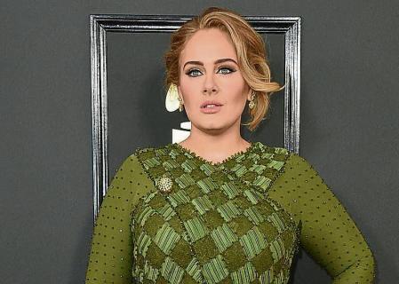 FILE - Adele arrives at the 59th annual Grammy Awards on Feb. 12, 2017, in Los Angeles. The singer will share custody of her 8-year-old son and wonâ#{emoji}128;#{emoji}153;t be paying child support to her now-ex-husband Simon Konecki. The couple separated in August of 2019, and Adele filed for divorce the following month. A Los Angeles judge finalized the divorce last week. (Photo by Jordan Strauss/Invision/AP, File)