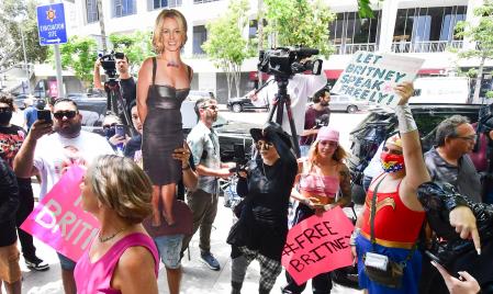 TOPSHOT - A life-size cardboard cutout of Britney Spears in seen as fans and supporters gather outside the County Courthouse in Los Angeles, California on June 23, 2021, during a scheduled hearing in Spears' conservatorship case. - Pop singer Britney Spears urged a US judge on June 23, to end a controversial guardianship that has given her father control over her affairs since 2008.
