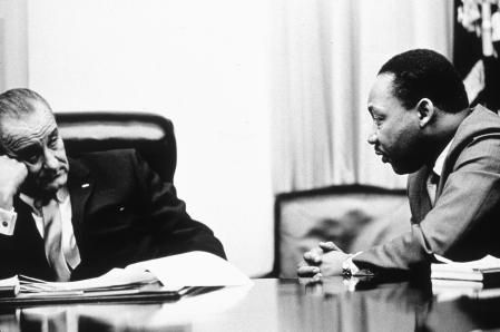 President Lyndon B Johnson (1908 - 1973) discusses the Voting Rights Act with civil rights campaigner Martin Luther King Jr. (1929 - 1968). The act, part of President Johnson's 'Great Society' program trebled the number of black voters in the south, who had previously been hindered by racially inspired laws, 1965. (Photo by  Hulton Archive/Getty Images)
