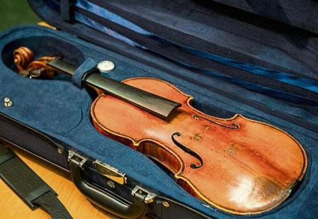 NEW YORK, NY - AUGUST 06: Roman Totenberg's Stadivarius violin, which was stolen after a concert 35 years ago, is seen at an FBI press conference announcing the recovery of the violin on August 6, 2015 in New York City. Totenberg was a famed violinist who died three years ago. (Photo by Andrew Burton/Getty Images)