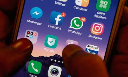 (FILES) In this file photo taken on March 22, 2018 This photo illustration taken on March 22, 2018 shows apps for Facebook, Instagram, Whatsapp and other social networks on a smartphone in Chennai, India. - Major social media services including Facebook, Instagram and WhatsApp were hit by a massive outage on October 4, 2021, tracking sites showed, impacting potentially tens of millions of users. (Photo by ARUN SANKAR / AFP)