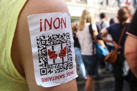 A demonstrator with a sticker reading 