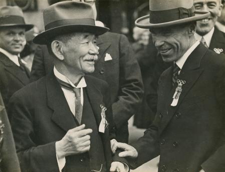 BERLIN, GERMANY - JULY 31:     Japanese International Olympic Committee member jodoka Jigoro Kano (L) smiles as the 1940 Olympic Games goes to Tokyo after the vote during the IOC congress at Hotel Adlon on July 31, 1936 in Berlin, Germany