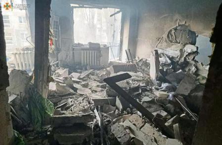 This handout picture taken and released by the Ukrainian State Emergency Service on March 7, 2022, shows a damaged residential building after Russian multiple rocket launchers BM-30 Smerch shelled the area in the southern city of Mykolaiv. - Ukraine's military says it is fighting 