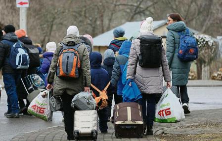 MEDYKA, POLAND - MARCH 09: Women and children arrive from war-torn Ukraine at the Medyka border crossing on March 09, 2022 in Medyka, Poland. Over one million people have arrived in Poland from Ukraine since the Russian invasion of February 24, and while many are now living with relatives who live and work in Poland, others are journeying onward to other countries in Europe. (Photo by Sean Gallup/Getty Images)