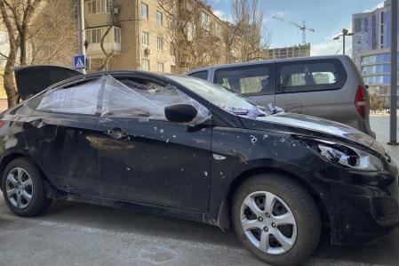 A car damaged by shelling that was used by Associated Press journalists to escape from the Mariupol blockade sits parked Ukraine, Thursday, March 17, 2022. (AP Photo/Mstyslav Chernov)