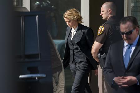 Washington (United States), 11/04/2022.- American actress Amber Heard departs the courthouse following the first day of Depp v Heard at the Fairfax County Courthouse in Fairfax, Virginia, USA, 11 April 2022. Johnny Depp's 50 million US dollars defamation lawsuit against Amber Heard had jury selection today and is expected to last five or six weeks. (Estados Unidos) EFE/EPA/SHAWN THEW